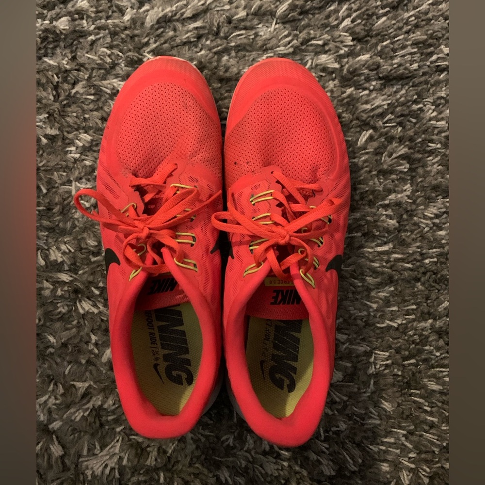 Orange Nike free 5.0  size 13.  See pictures for flaws.  Plenty of life left.
